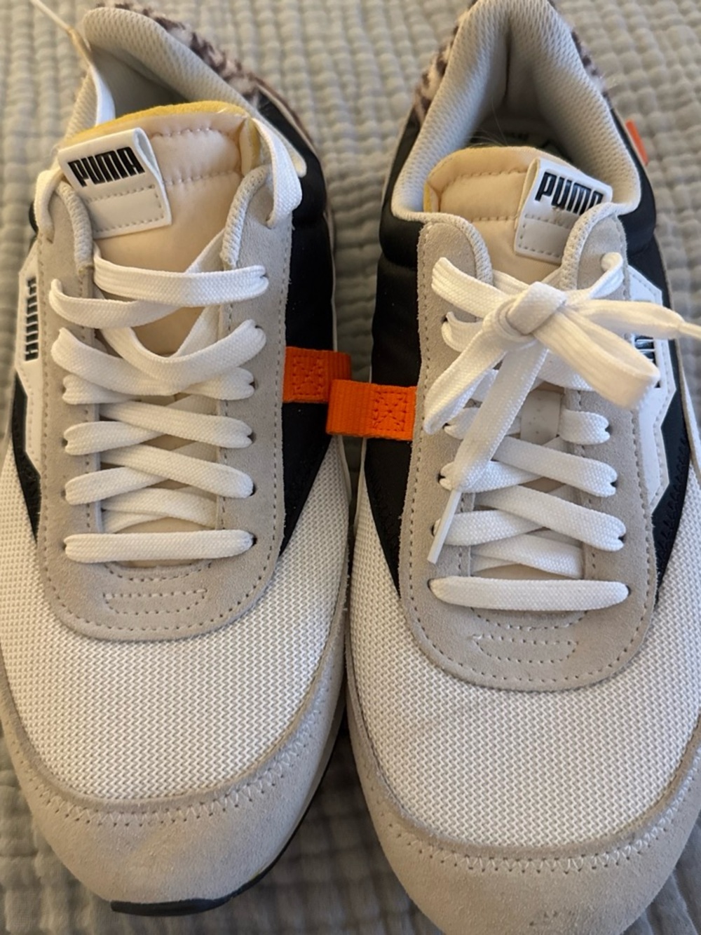 Puma women’s White, Black and Orange animal print Low-Top Sneakers